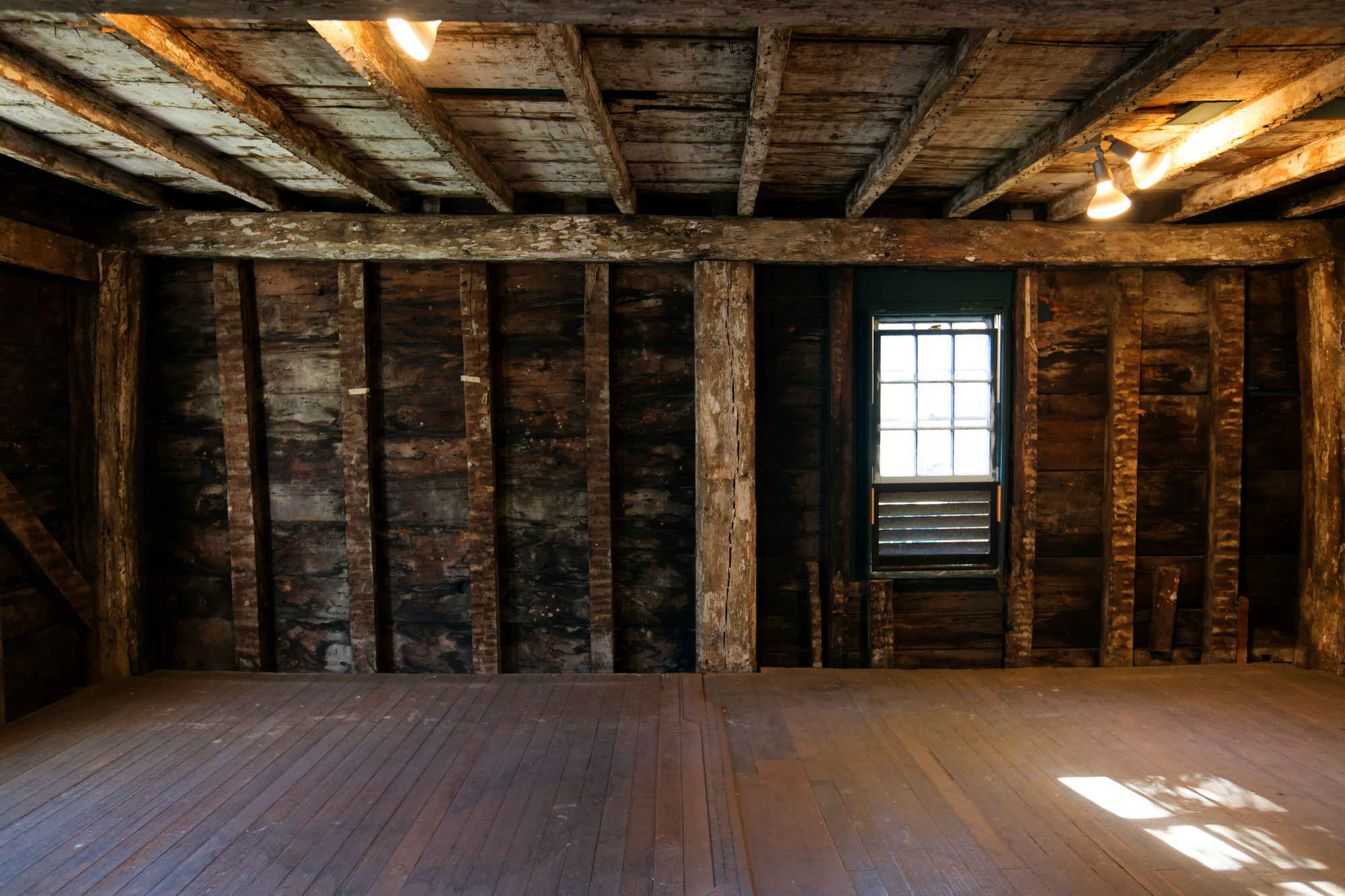 Interior room with exposed beams and framing