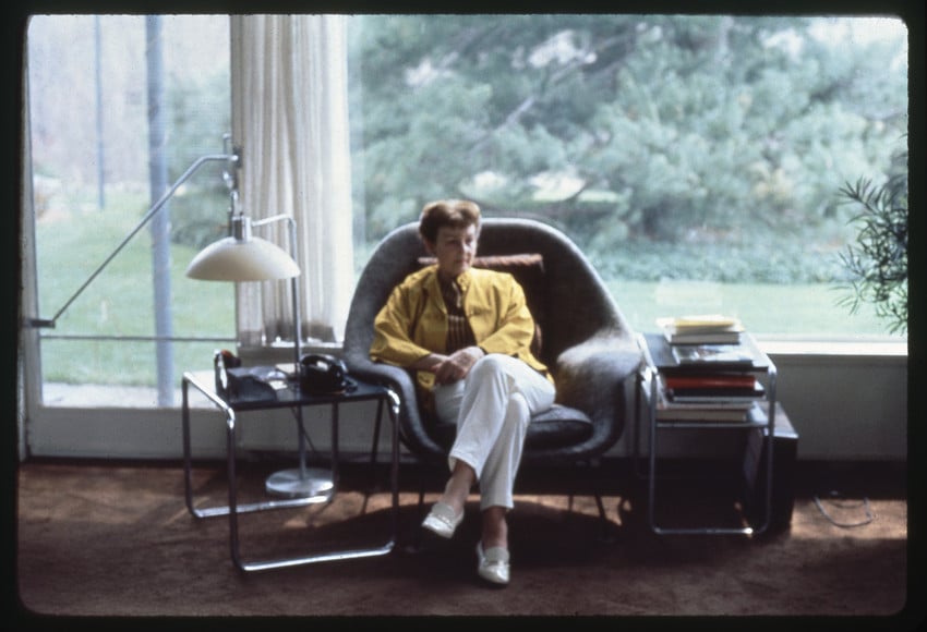 Ise Gropius sitting in a Womb Chair in the living room at Gropius House